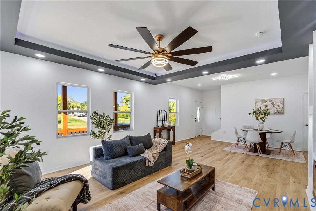 223 S Crater Road, Petersburg, VA 23803 Tray ceiling with dark-toned trim, expansive multi-blade ceiling fan, wood-finish flooring, and recessed lighting