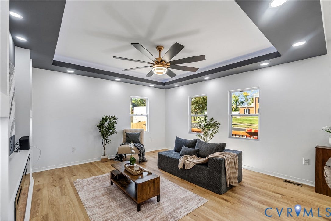 223 S Crater Road, Petersburg, VA 23803 Tray ceiling featuring a dark-toned perimeter, recessed lighting, multi-blade ceiling fan, and light-toned wood-finish flooring
