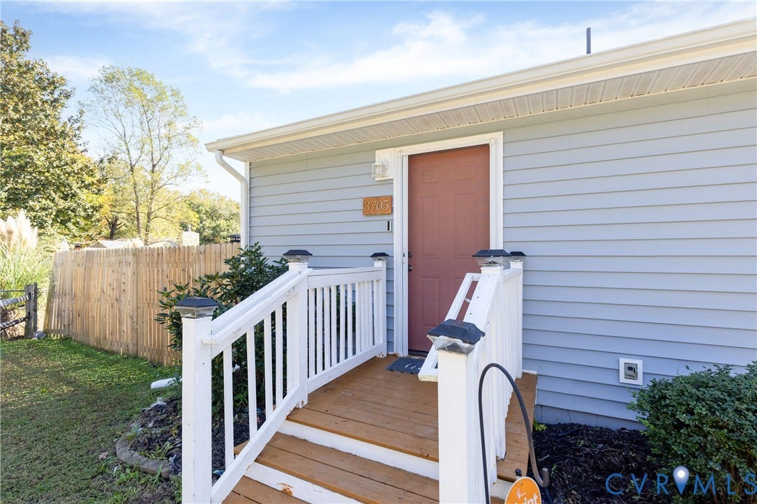 3705 Yard Arm Drive, Chesterfield, VA 23831 Exterior entrance featuring horizontal lap siding, wood-finish steps, and white balustrade railing