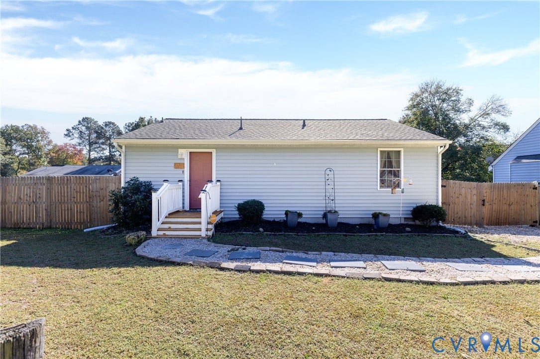 3705 Yard Arm Drive, Chesterfield, VA 23831 Single-story residence featuring light-colored horizontal siding, a pitched shingle roof, a front entry with wooden stairs and white railings, and a stone-paver walkway bordered by gravel