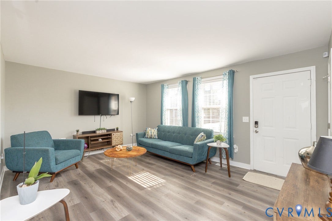 3705 Yard Arm Drive, Chesterfield, VA 23831 Living area featuring wood-finish flooring, two multi-pane windows, and a panel-style entry door