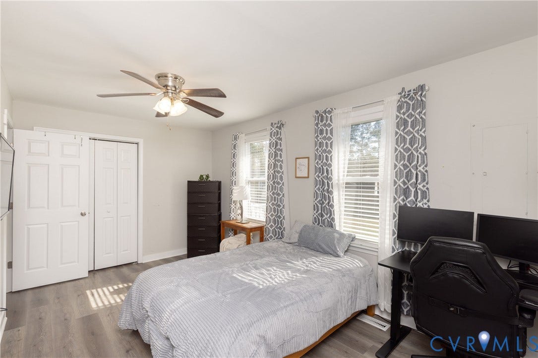 3705 Yard Arm Drive, Chesterfield, VA 23831 Room featuring wood-finish flooring, dual windows, ceiling fan with integrated lighting, and dual-panel closet doors