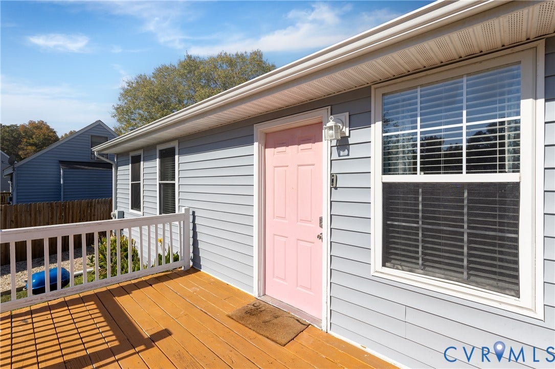3705 Yard Arm Drive, Chesterfield, VA 23831 Exterior featuring horizontal lap siding, a wooden deck, a white railing, and a window with white trim