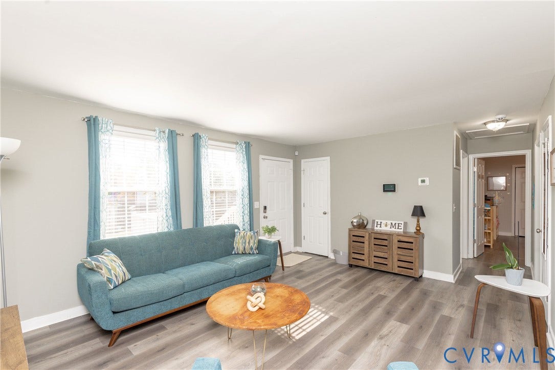 3705 Yard Arm Drive, Chesterfield, VA 23831 Neutral-toned interior space featuring wood-finish flooring, dual windows with multi-pane glazing, and two six-panel doors
