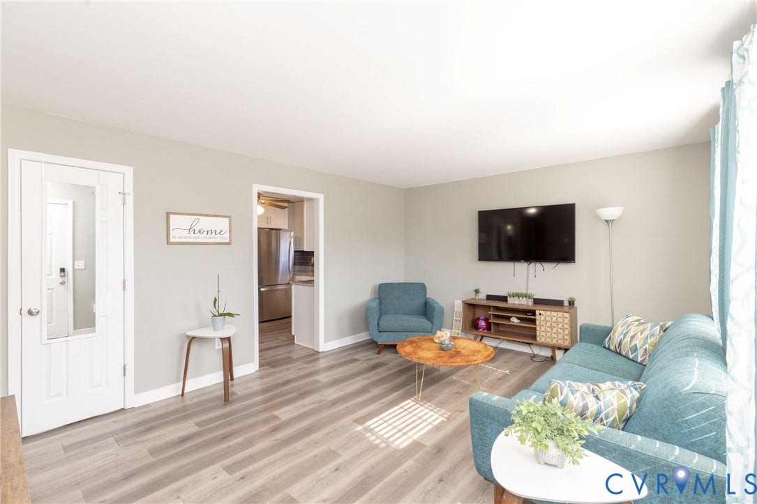 3705 Yard Arm Drive, Chesterfield, VA 23831 Living area featuring neutral wall paint, wood-finish flooring, and a glass-paneled interior door
