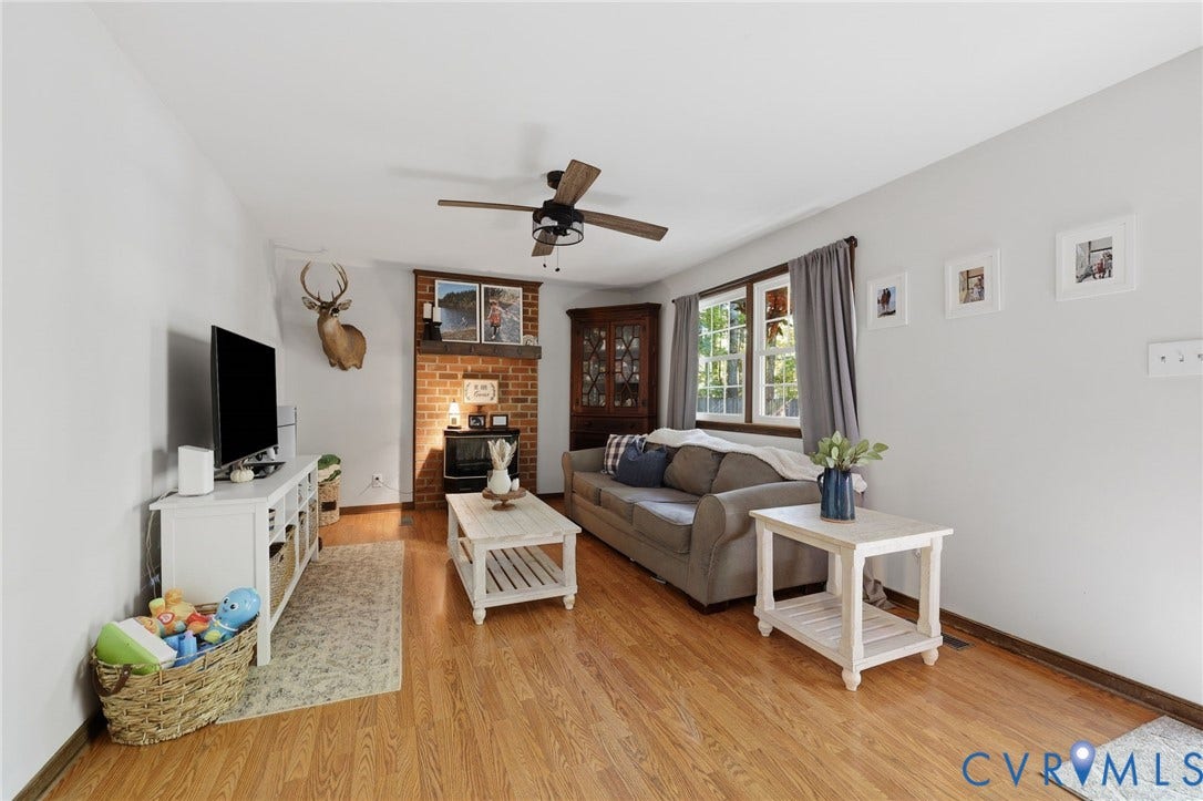 2764 Birdsong Lane, Powhatan, VA 23139 Featuring a floor-to-ceiling brick fireplace with a wood mantel, and ceiling fan
