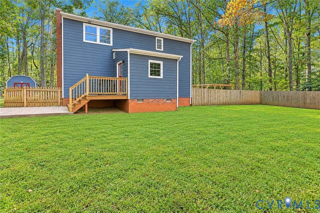 2764 Birdsong Lane, Powhatan, VA 23139 Rear fenced in backyard. *Photo digitally enhanced; grass and select personal items removed*