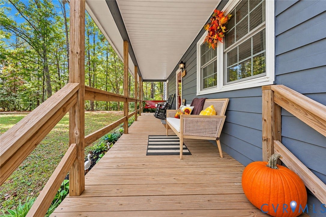 2764 Birdsong Lane, Powhatan, VA 23139 Covered front porch featuring a horizontal lap siding exterior, wood railings, and multi-pane windows