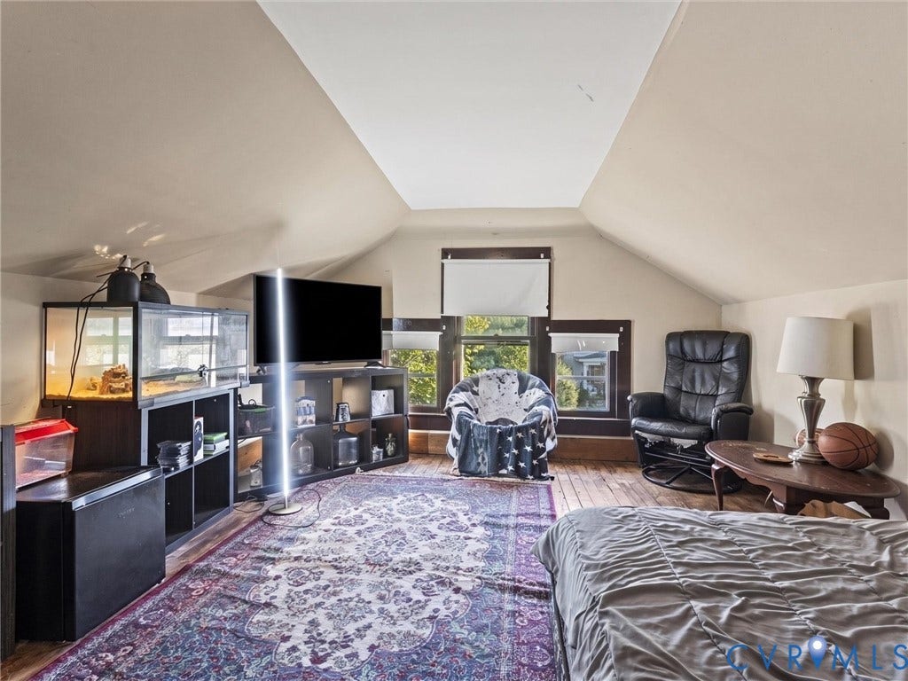 124 Suffolk Avenue, Chesterfield Highlands, Colonial Heights, VA 23834 Bedroom featuring vaulted ceilings, wood flooring, and multi-pane windows with dark-stained wood trim
