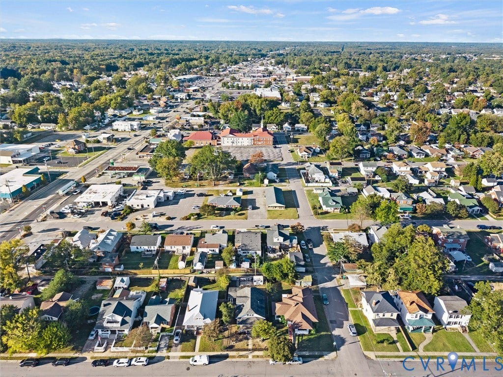 124 Suffolk Avenue, Chesterfield Highlands, Colonial Heights, VA 23834 Aerial perspective of neighborhood and surrounding areas featuring mature tree canopy, paved street grids, and proximity to local commercial centers