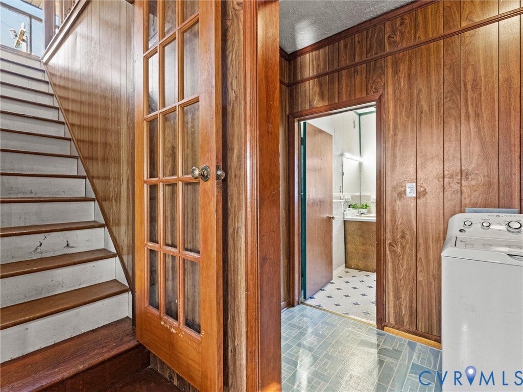 124 Suffolk Avenue, Chesterfield Highlands, Colonial Heights, VA 23834 Wood-paneled walls, French door with glass panes, interior staircase with wood treads, and patterned vinyl flooring