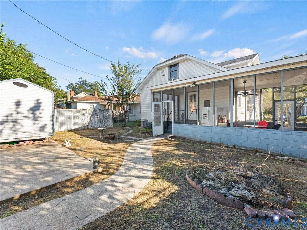 124 Suffolk Avenue, Chesterfield Highlands, Colonial Heights, VA 23834 Exterior space featuring a large screened-in porch with a concrete block foundation, a flagstone-style pathway, a detached storage shed