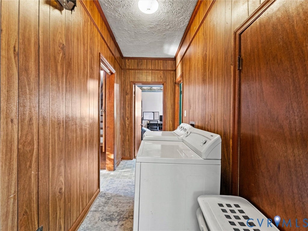 124 Suffolk Avenue, Chesterfield Highlands, Colonial Heights, VA 23834 Hallway featuring wood-finish wall paneling, textured ceiling, and vinyl flooring