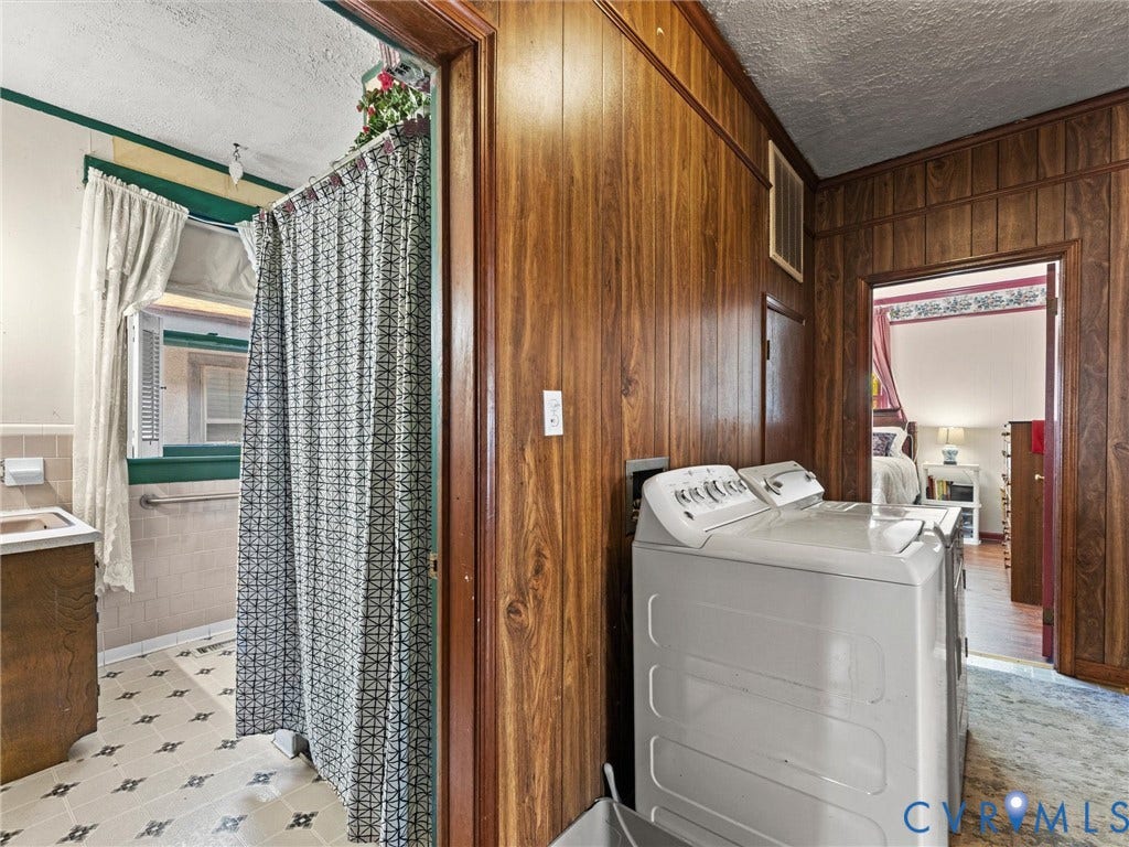 124 Suffolk Avenue, Chesterfield Highlands, Colonial Heights, VA 23834 Wood-panelled wall treatments, vinyl flooring, and built-in vanity cabinet