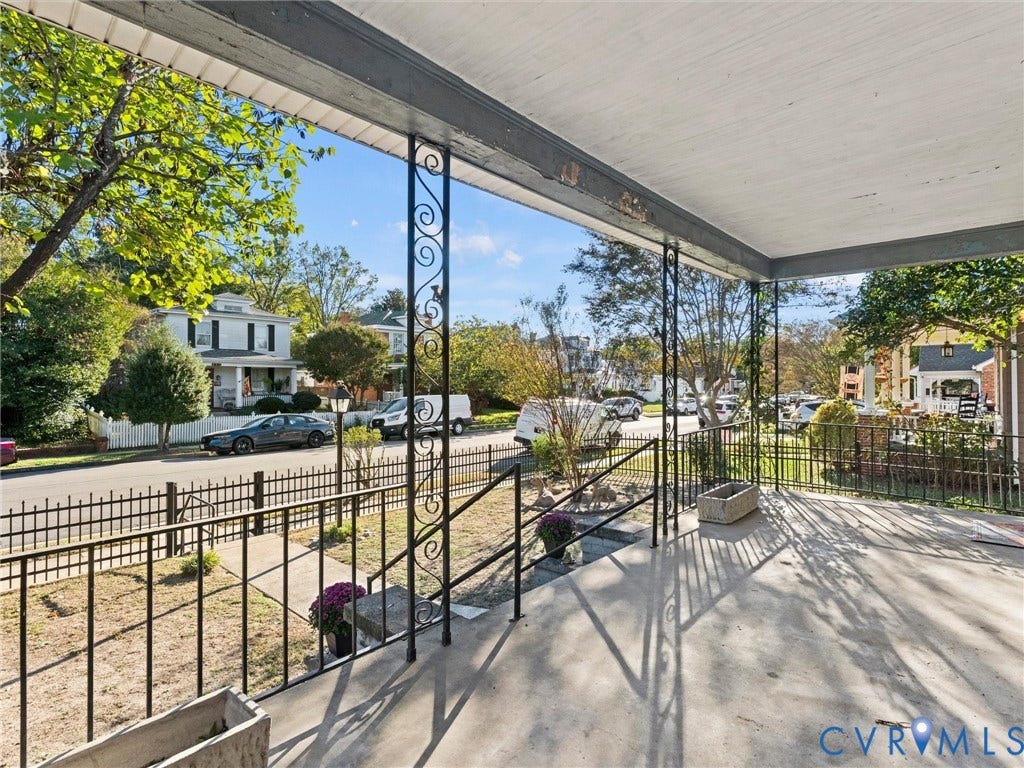 124 Suffolk Avenue, Chesterfield Highlands, Colonial Heights, VA 23834 Covered porch featuring concrete flooring, decorative wrought-iron support columns, and wrought-iron railings