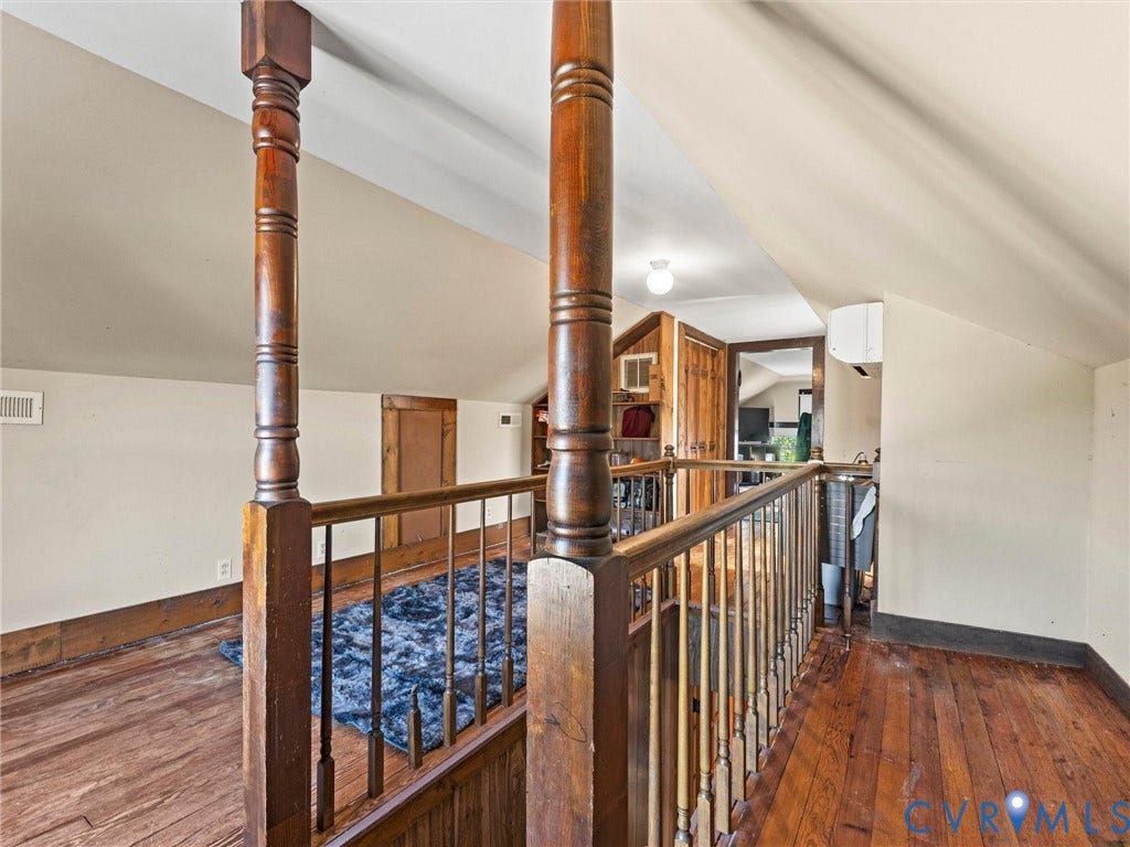 124 Suffolk Avenue, Chesterfield Highlands, Colonial Heights, VA 23834 Upper level area featuring wood flooring, vaulted ceilings, and a handcrafted wooden balustrade with detailed newel posts