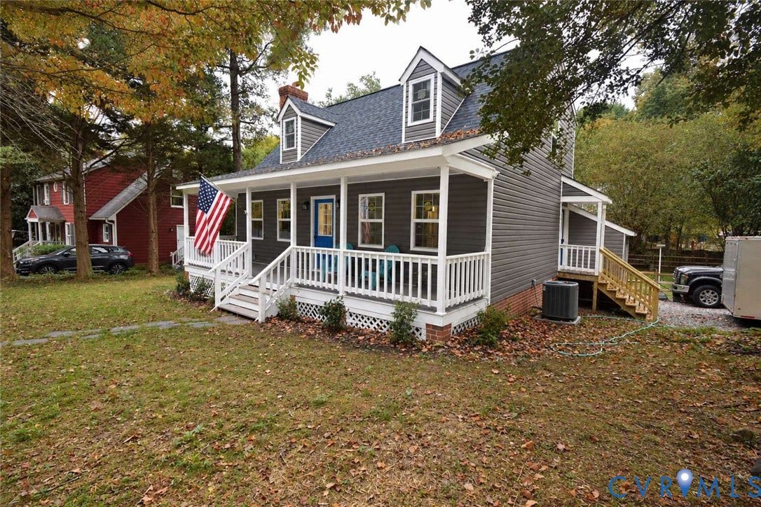 7300 Key Deer Court, Deer Run, Midlothian, VA 23112 Cape Cod-style residence featuring horizontal lap siding, a front covered porch with white railings, and dual dormer windows