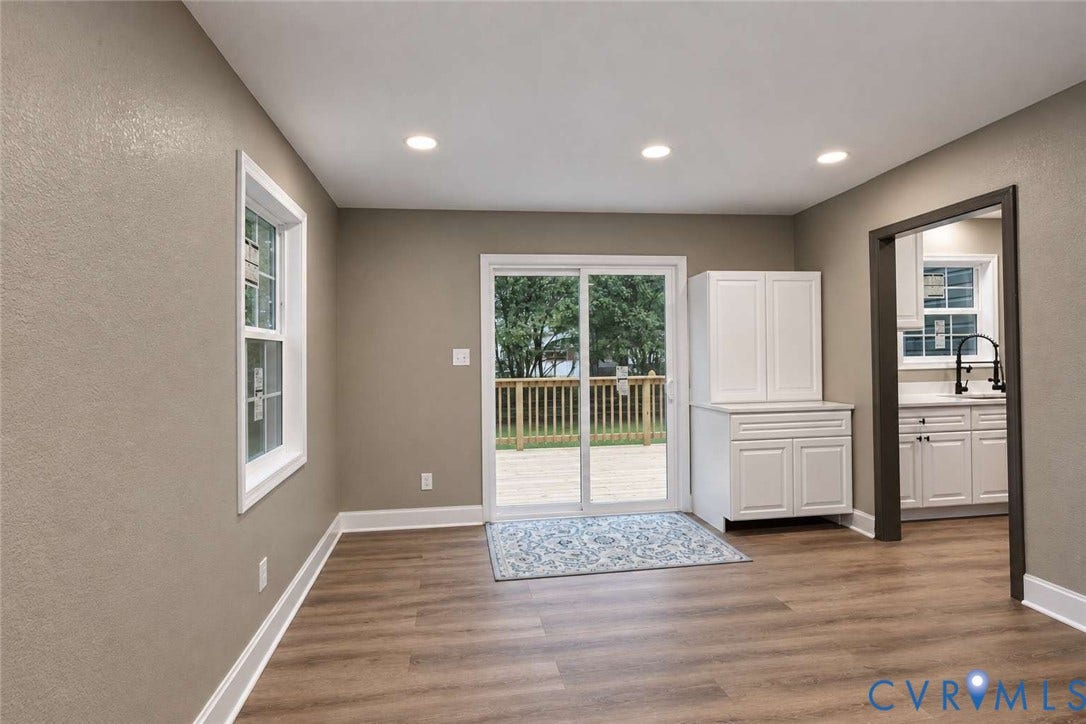 7300 Key Deer Court, Deer Run, Midlothian, VA 23112 Wood-finish flooring, recessed lighting, sliding glass door, and built-in white cabinetry