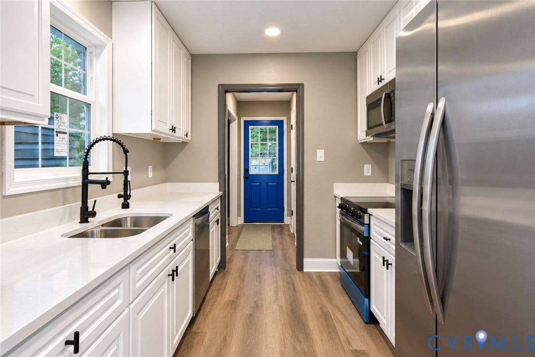 7300 Key Deer Court, Deer Run, Midlothian, VA 23112 Kitchen featuring white cabinetry, solid-surface countertops, wood-finish flooring, a stainless steel refrigerator, and a matte black gooseneck faucet