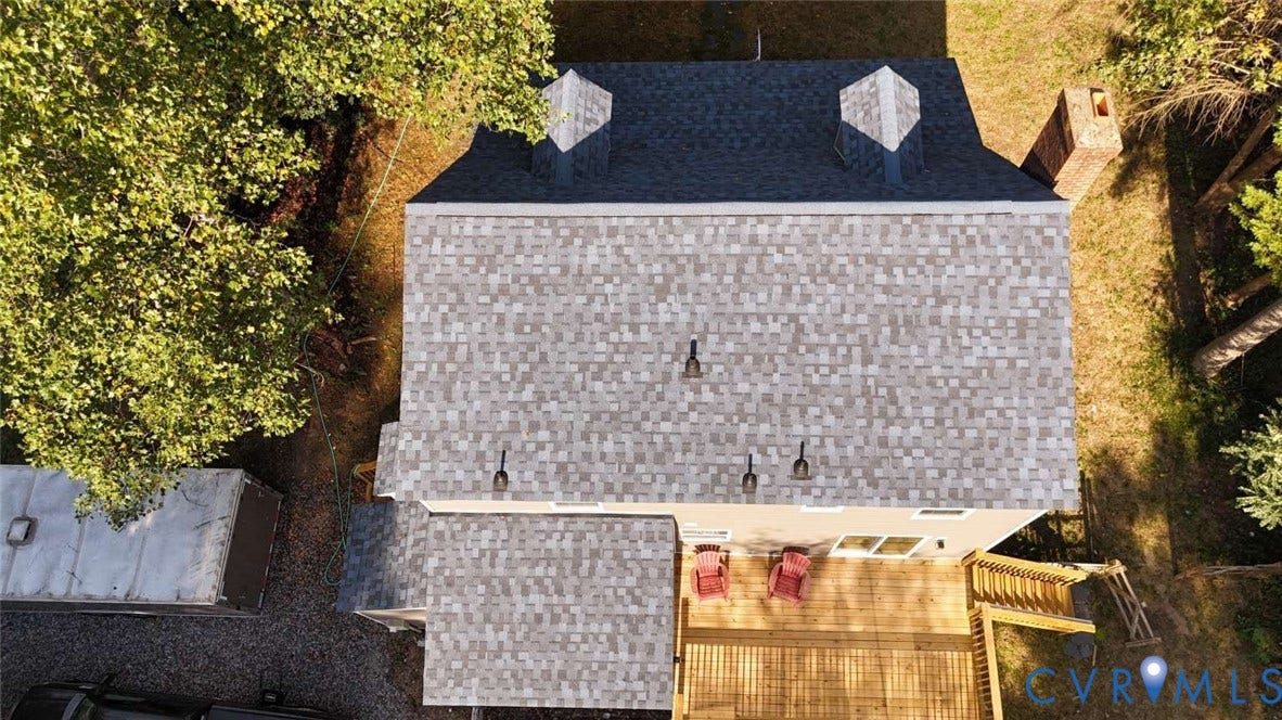 7300 Key Deer Court, Deer Run, Midlothian, VA 23112 Aerial perspective featuring a multi-pitched shingle roof with two dormers, a masonry chimney, and a wooden deck