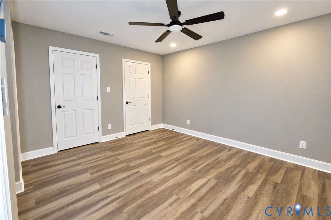 7300 Key Deer Court, Deer Run, Midlothian, VA 23112 Neutral-toned interior featuring wood-finish flooring, a contemporary ceiling fan with integrated lighting, recessed lighting, and six-panel doors with matte black hardware