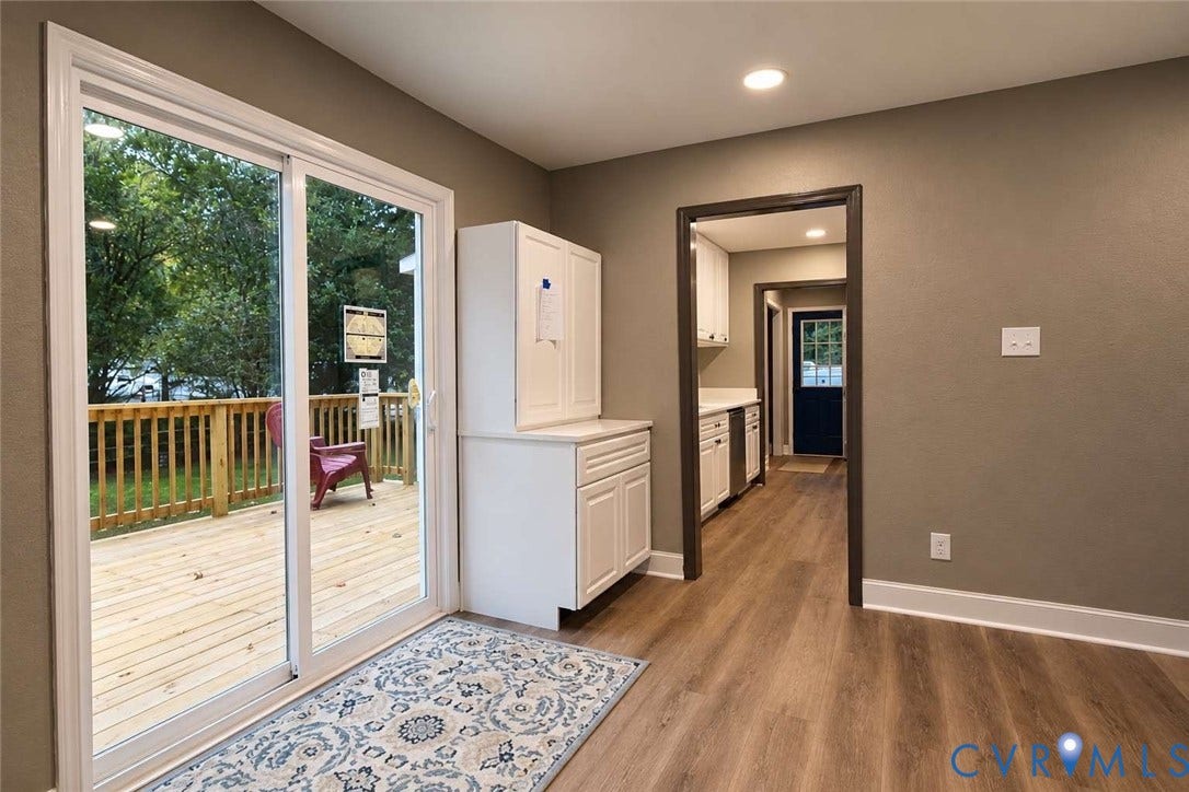 7300 Key Deer Court, Deer Run, Midlothian, VA 23112 Wood-finish flooring, sliding glass patio door, white built-in cabinetry, and access to an outdoor deck