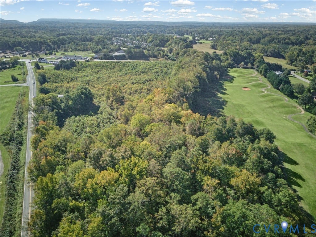 2010 Manakin Road, Sycamore Creek, Goochland, VA 23103 Expansive land parcel featuring dense mature woodland, rolling topography, and direct frontage to a paved roadway