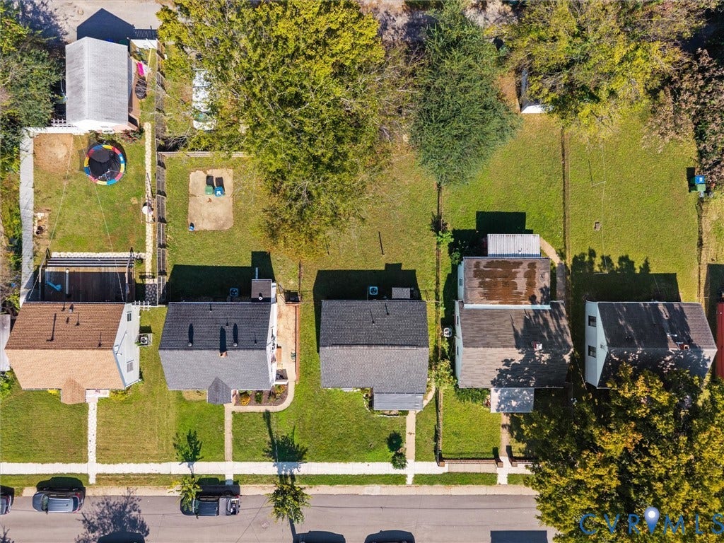 1826 Claiborne Street, Byrd Park, Richmond, VA 23220 Aerial perspective of a residential block featuring gable-roofed structures, expansive lawn areas, mature trees, and paved street access