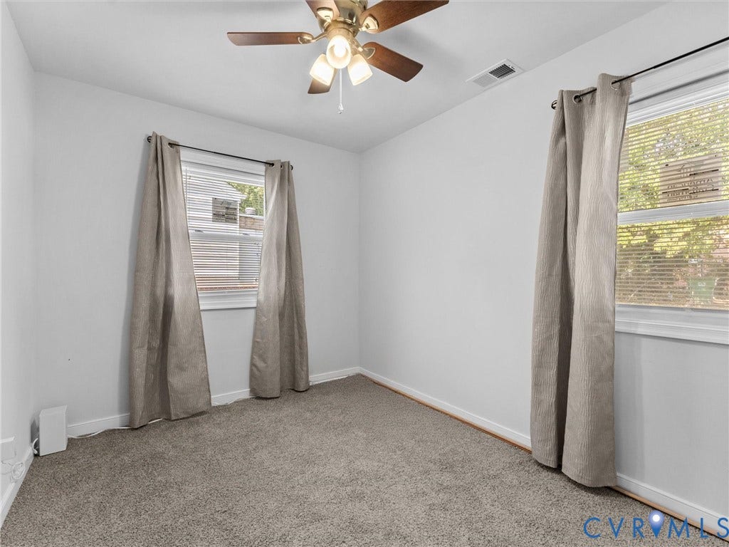 1826 Claiborne Street, Byrd Park, Richmond, VA 23220 Neutral-toned carpeted flooring, two windows with horizontal blinds, and a ceiling-mounted light fixture with a fan