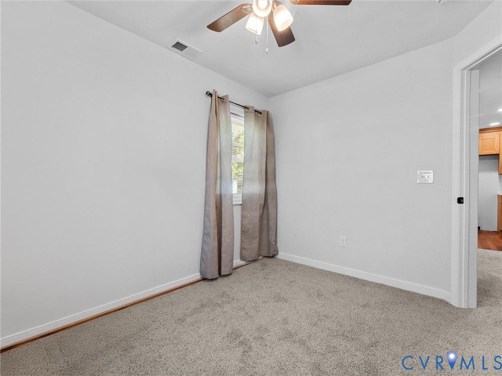 1826 Claiborne Street, Byrd Park, Richmond, VA 23220 Neutral interior room featuring neutral carpeting and a ceiling-mounted light fixture with a central fan