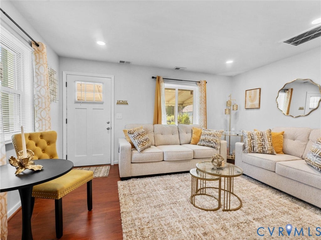 1826 Claiborne Street, Byrd Park, Richmond, VA 23220 Living area featuring wood-finish flooring, white-painted walls, and a single-light entry door
