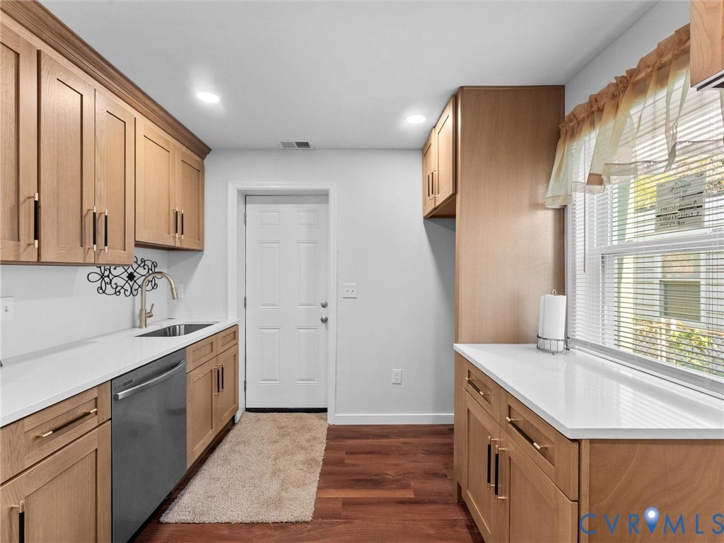 1826 Claiborne Street, Byrd Park, Richmond, VA 23220 Light wood-finish cabinetry, quartz countertops, stainless steel dishwasher, undermount kitchen sink, and wood-finish flooring