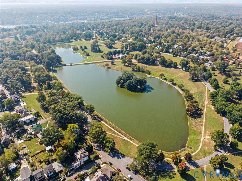 1826 Claiborne Street, Byrd Park, Richmond, VA 23220 Aerial perspective featuring a large lake, central island, surrounding green space, paved pathways, and mature trees