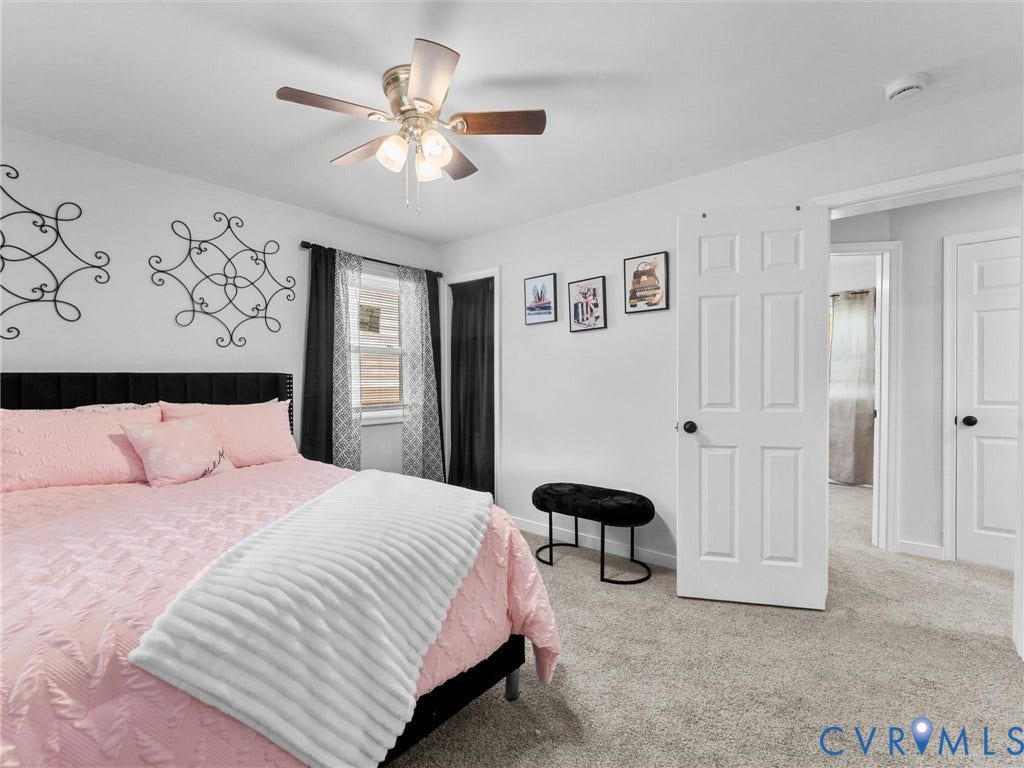 1826 Claiborne Street, Byrd Park, Richmond, VA 23220 Room featuring plush carpeting, a central ceiling fan with multi-light fixture, and two panel-style interior doors