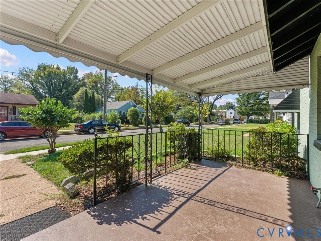 1826 Claiborne Street, Byrd Park, Richmond, VA 23220 Covered front porch featuring concrete flooring and decorative wrought-iron railings