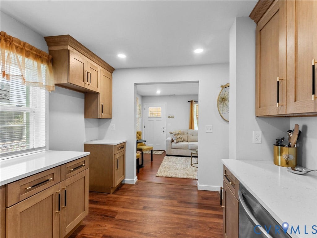 1826 Claiborne Street, Byrd Park, Richmond, VA 23220 Kitchen featuring light-tone wood cabinetry, solid-surface white countertops, recessed lighting, and wood-finish flooring