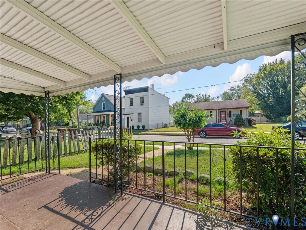 1826 Claiborne Street, Byrd Park, Richmond, VA 23220 Covered front porch featuring a concrete floor, decorative metal railings, and a metal roof canopy