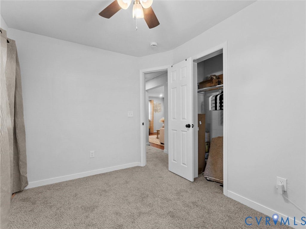 1826 Claiborne Street, Byrd Park, Richmond, VA 23220 Neutral-toned carpeted flooring, white interior walls, ceiling fan with integrated lighting, and a six-panel closet door