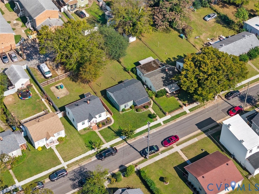 1826 Claiborne Street, Byrd Park, Richmond, VA 23220 Aerial perspective of suburban residential lots featuring mature trees, expansive lawns, paved street access, and sidewalk infrastructure