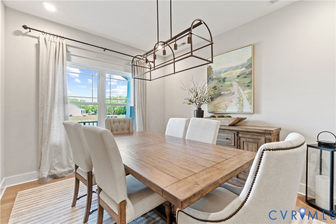 Lot 2 Summer Meadow Road, Beaverdam, VA 23015 Dining area featuring large windows, wood-finish flooring, and a decorative industrial-style rectangular pendant light fixture