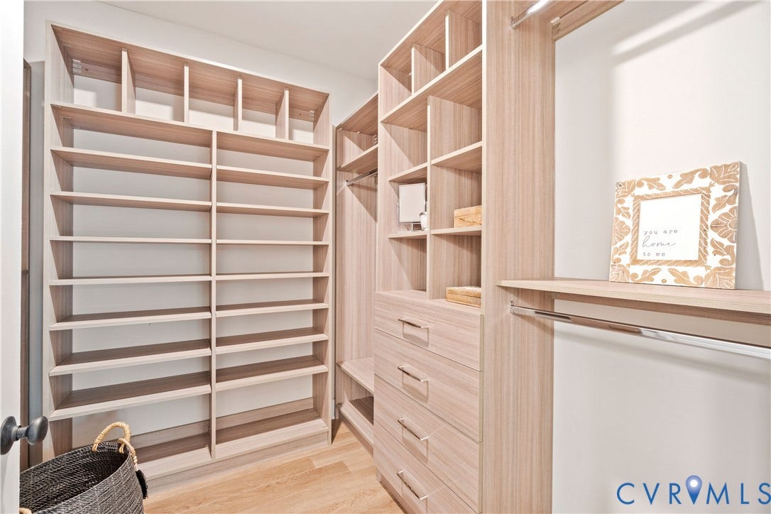 Lot 2 Summer Meadow Road, Beaverdam, VA 23015 Custom walk-in closet featuring light wood-finish cabinetry, floor-to-ceiling shelving, integrated hanging rods, and built-in dresser drawers