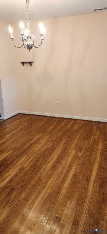 12400 New Point Drive, Wilde Lake, Henrico, VA 23233 Wood-finish flooring, multi-arm metal chandelier, and wall-mounted shelving