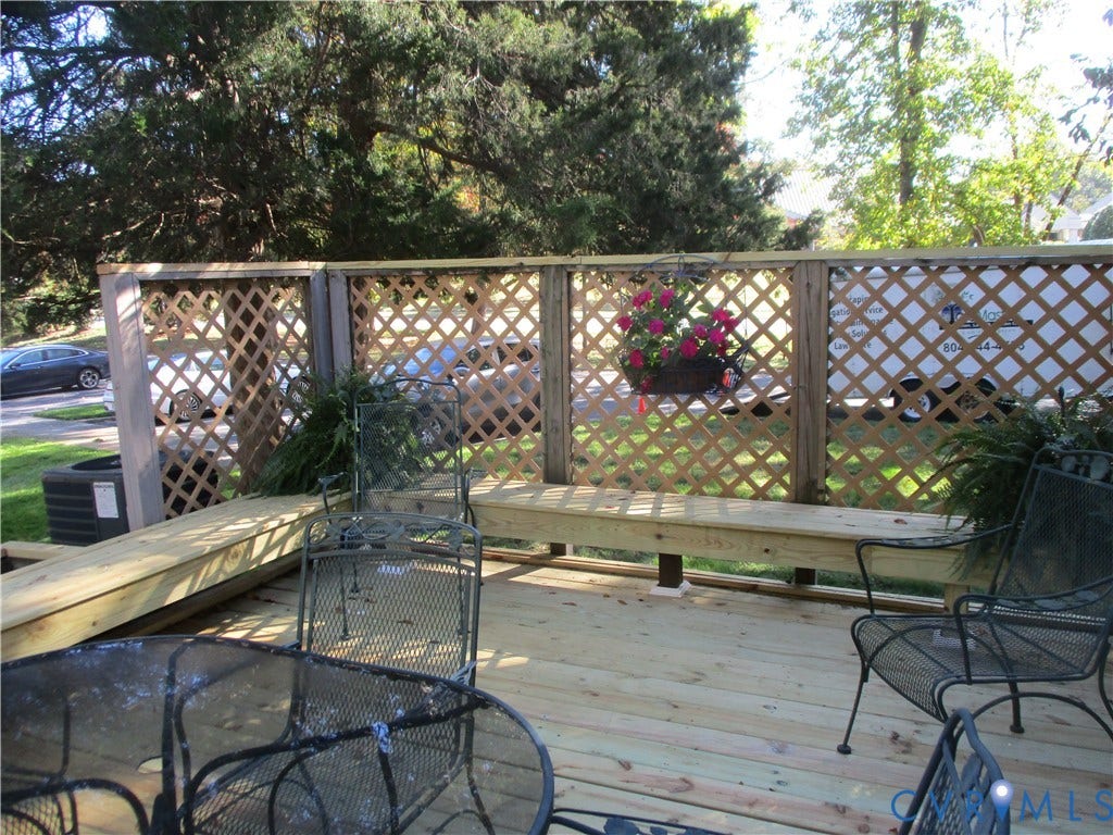 12400 New Point Drive, Wilde Lake, Henrico, VA 23233 Wood deck featuring integrated bench seating and a perimeter lattice privacy screen