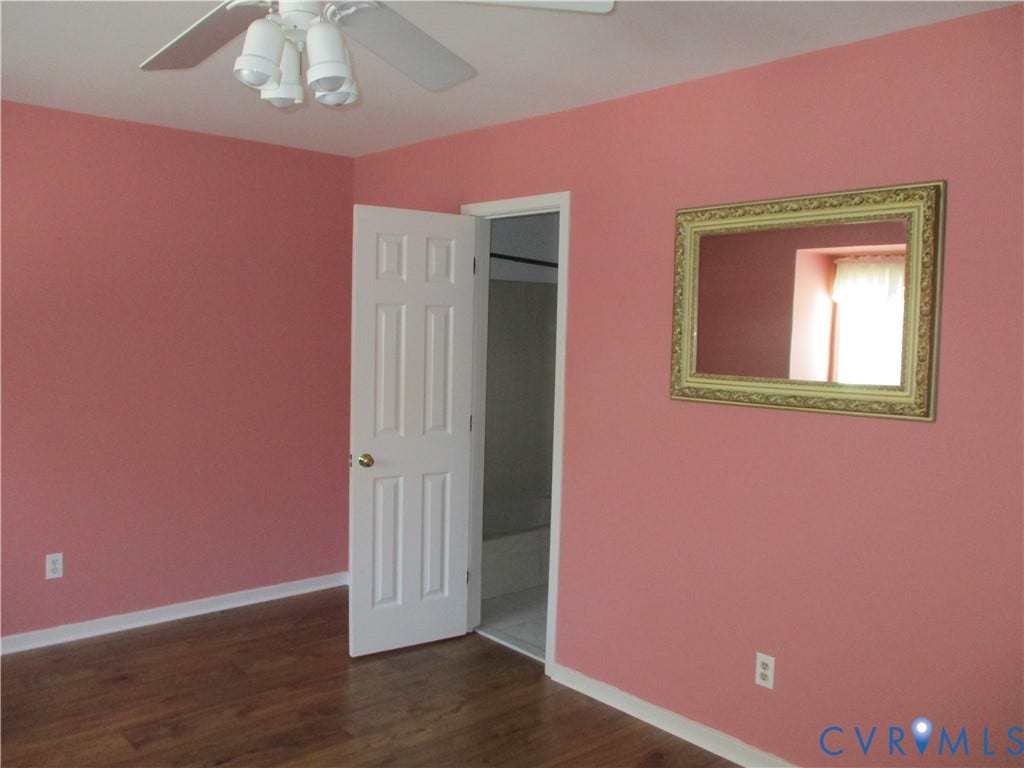 12400 New Point Drive, Wilde Lake, Henrico, VA 23233 Room featuring wood-finish flooring, a ceiling fan with integrated lighting, and a six-panel interior door