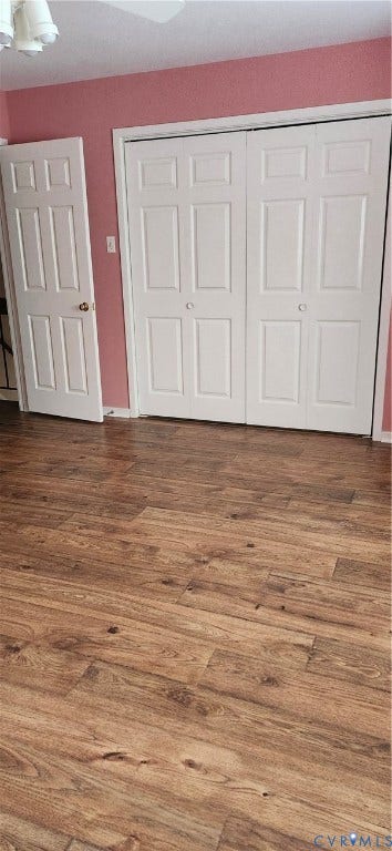 12400 New Point Drive, Wilde Lake, Henrico, VA 23233 Room featuring wood-finish flooring and dual-panel interior doors