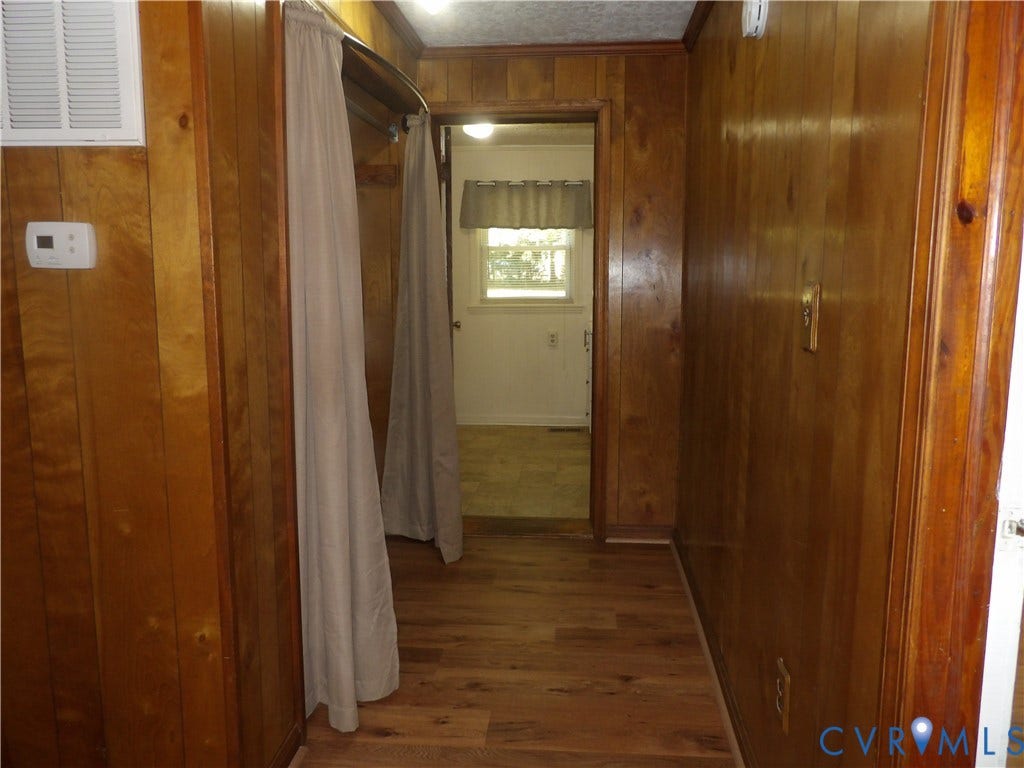 3206 South Street, Chester, VA 23831 Wood-panelled interior walls, wood-finish flooring, and a built-in recessed storage area
