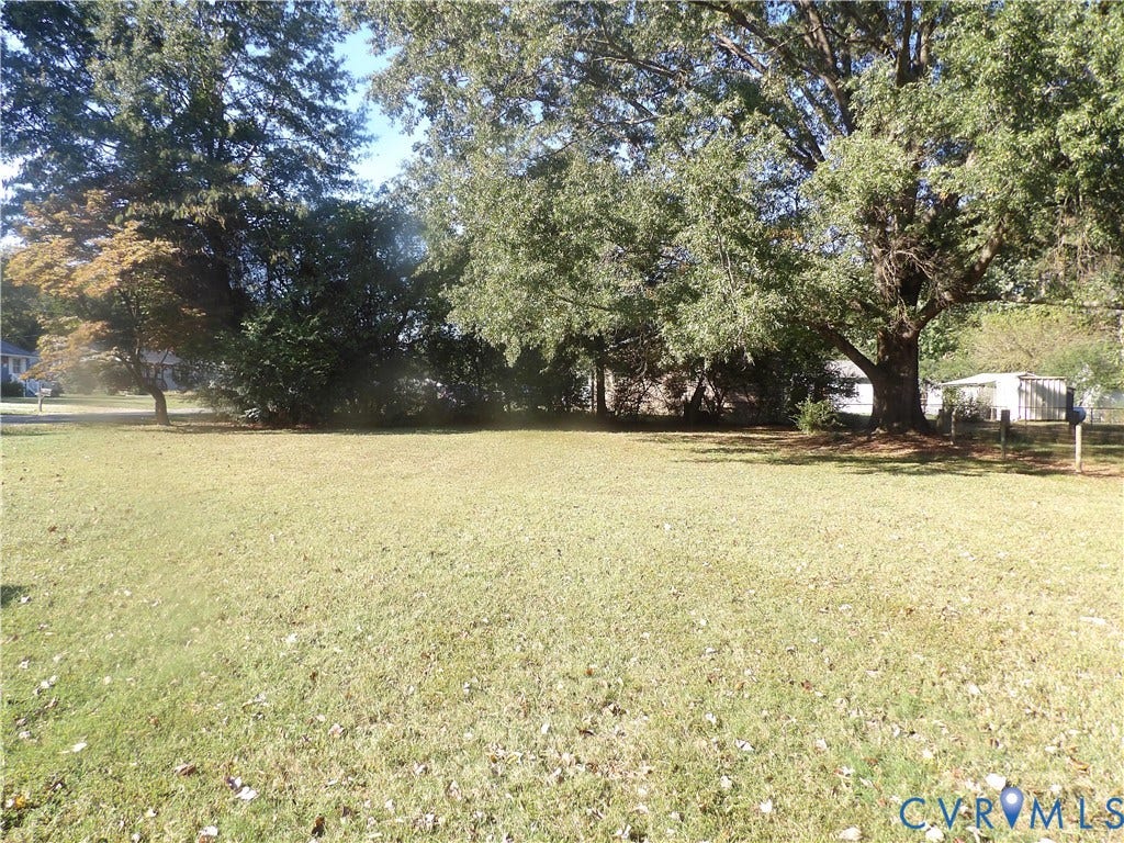 3206 South Street, Chester, VA 23831 Expansive level lot featuring mature hardwood trees and established landscaping