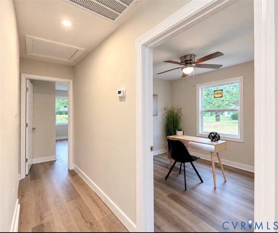 2800 Harris Hill Road, Dunnsville, VA 22454 Hallway and room interior featuring wood-finish flooring, neutral wall paint, recessed lighting, and a ceiling fan with integrated light fixture
