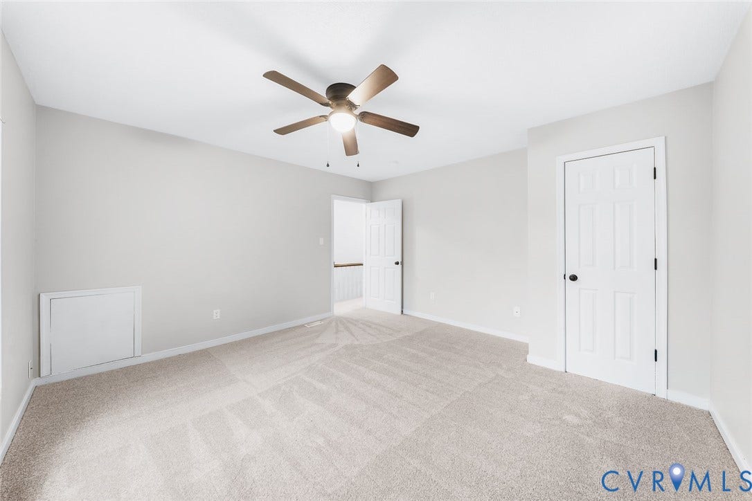 1802 Maury Street, Richmond, VA 23224 Neutral wall tones, wall-to-wall carpeting, ceiling fan with integrated lighting, and six-panel interior doors