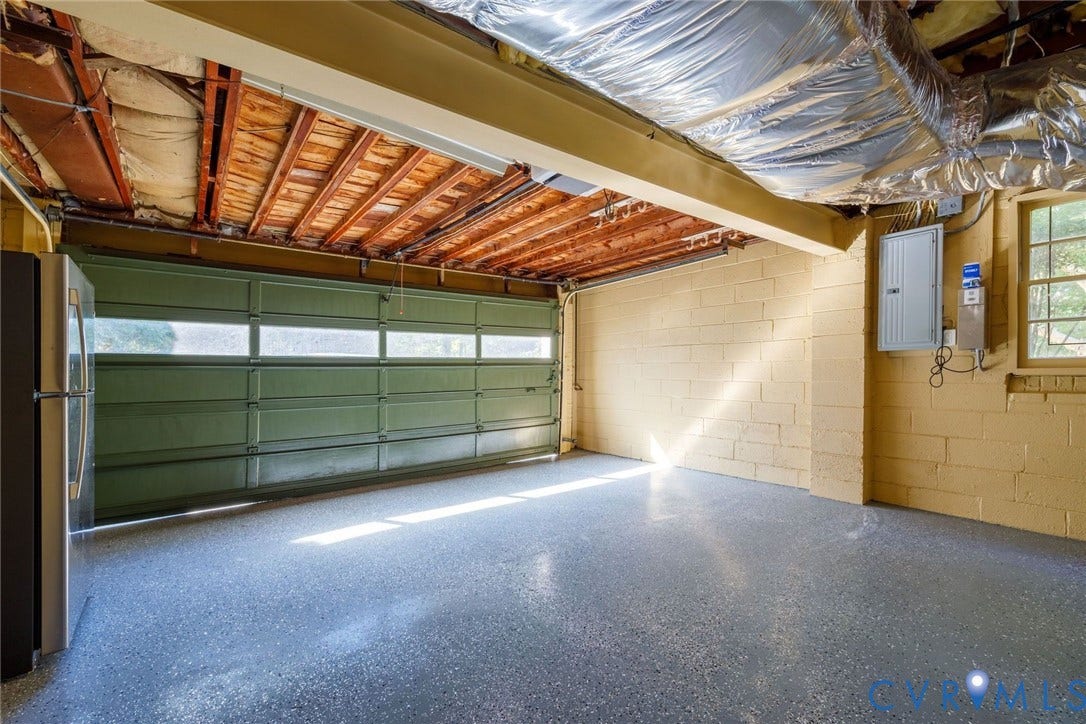 6805 River Road, Westham Ridge, Henrico, VA 23229 Two car garage with newly sealed floor and bonus mechanical room.